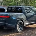 Rivian R1T's Quirky Feature: 'Carolina Squat' Achieved Through Camp Mode