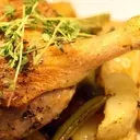Rustic Roasted Duck Legs with New Potatoes, Sugar Snaps, and Spring Onions