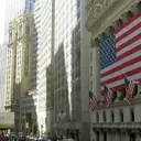 US Futures Dip Amidst Fed Remarks and Economic Data Ahead