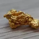 Gold Prices Rise as Dollar Weakens, Geopolitical Tensions Ease