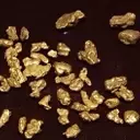 Gold Prices Ascend Amidst Dollar Weakness and Geopolitical Tensions