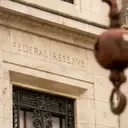 Fed Official Urges Swift Rate Hike Amid Stubborn Inflation