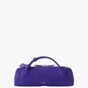 Fashion Week's Defining Trends: Purple Hues, Statement Brooches, and Inventive Styling