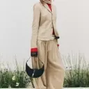 Embrace the Crescent: The Must-Have Bag Trend of the Season