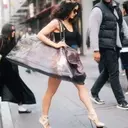 Rosalía's Bold Fashion Choices: Oversized Bags and Unique Ballet Platforms