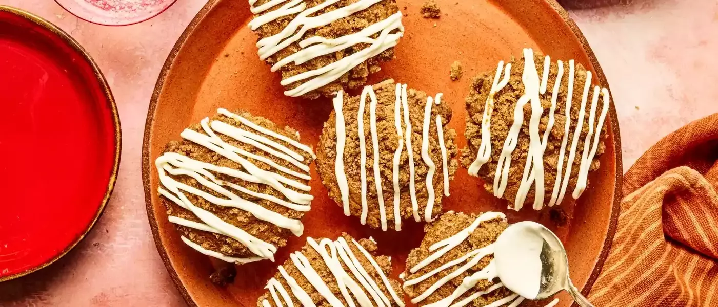 Delectable Gingerbread Muffins with Streusel Topping and Cream Cheese Glaze