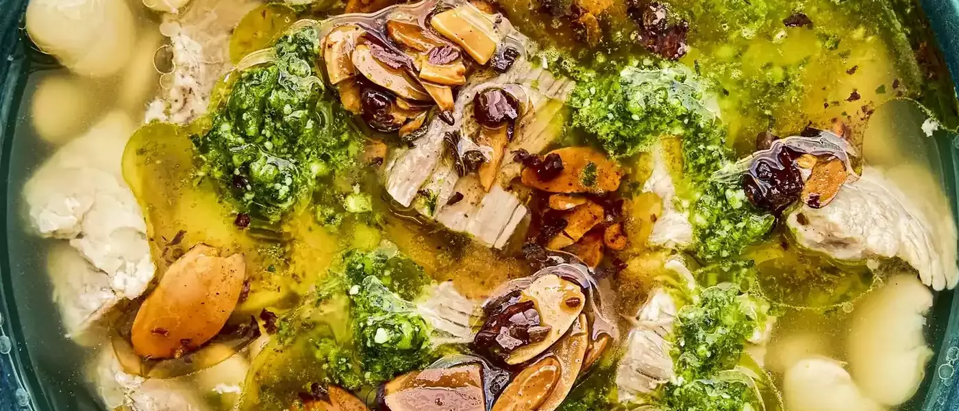 Mexican Brothy Beans with Pork, Salsa Macha, and Cilantro Pesto