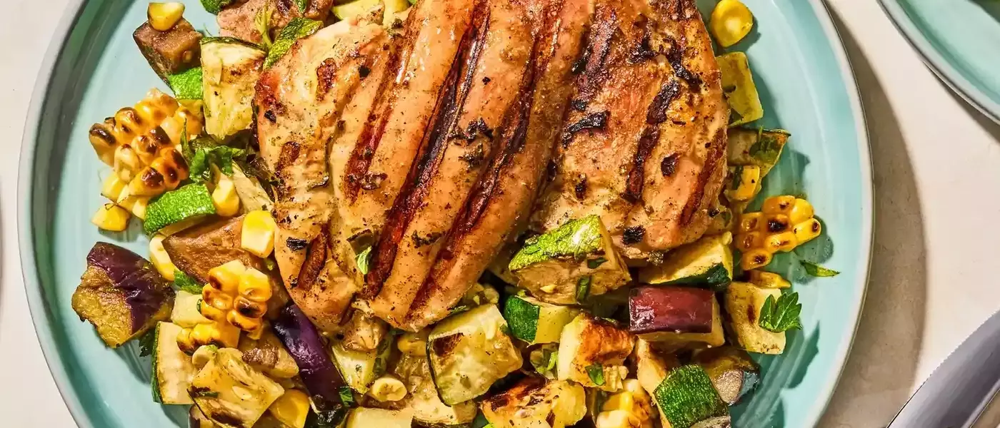 Flavorful Herb-Marinated Chicken Thighs with Grilled Vegetable Medley