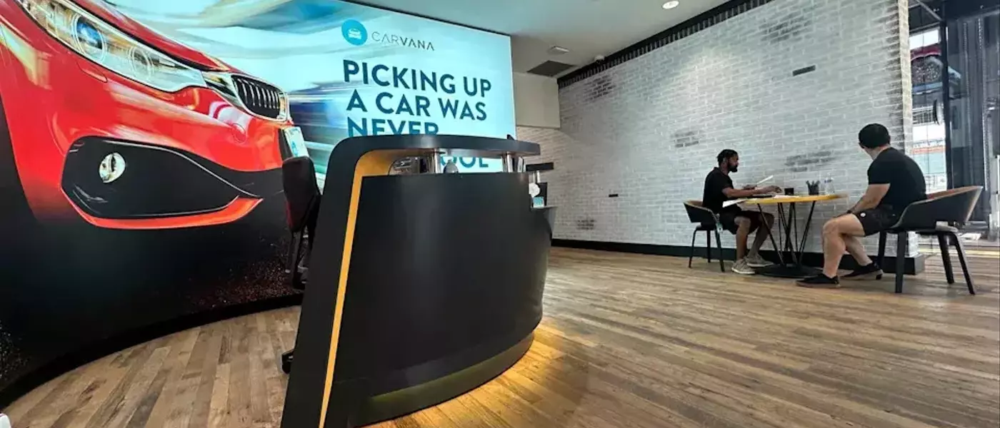 Carvana's Stock Dips Despite Record Quarter Amidst Disappointing Future Projections